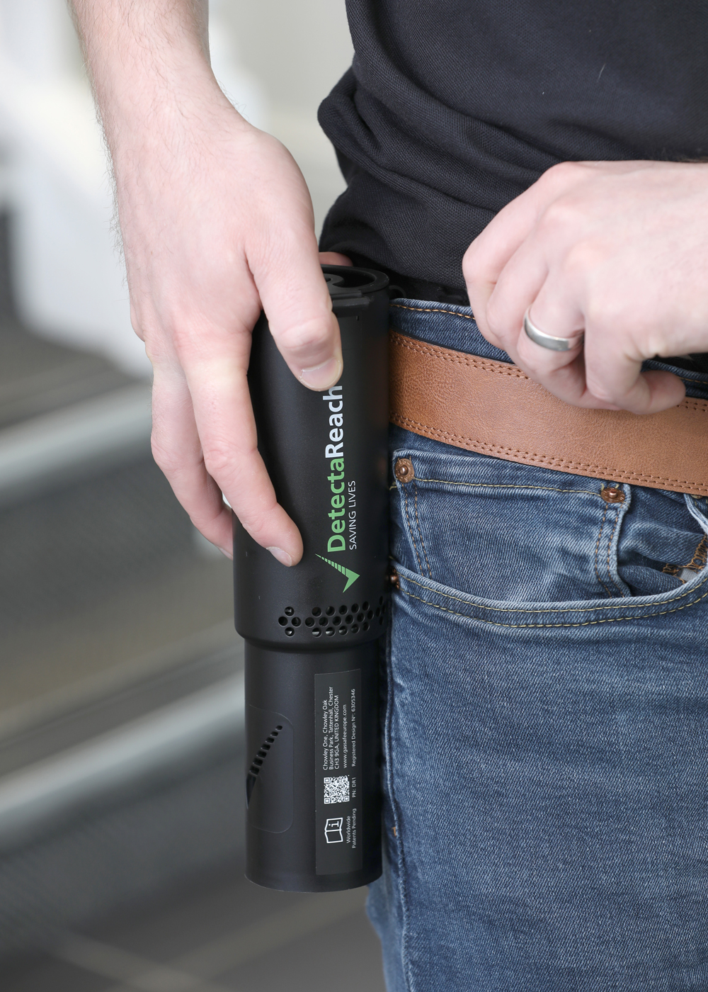 DetectaReach Aerosol Dispenser clipped onto belt